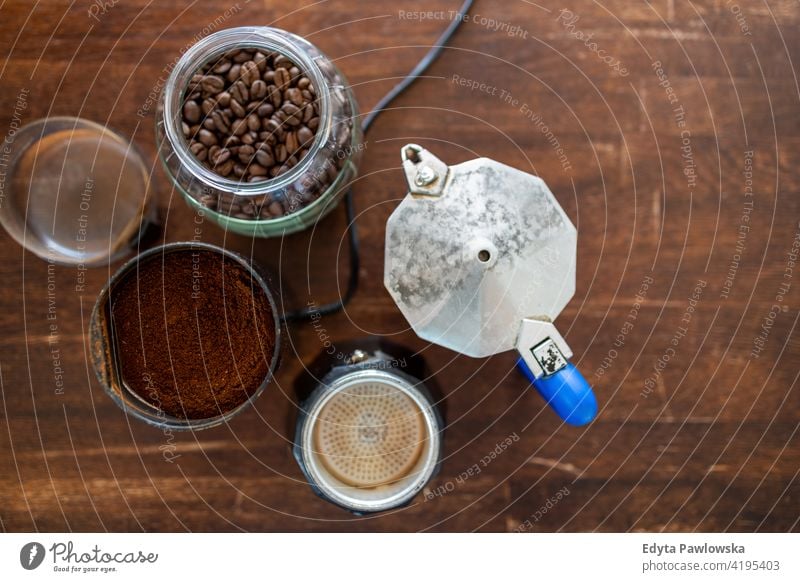 Above view of coffee supplies on wooden table preparation coffee percolator coffee maker hot roasted coffee crop cafe coffee beans cup of coffee coffee break