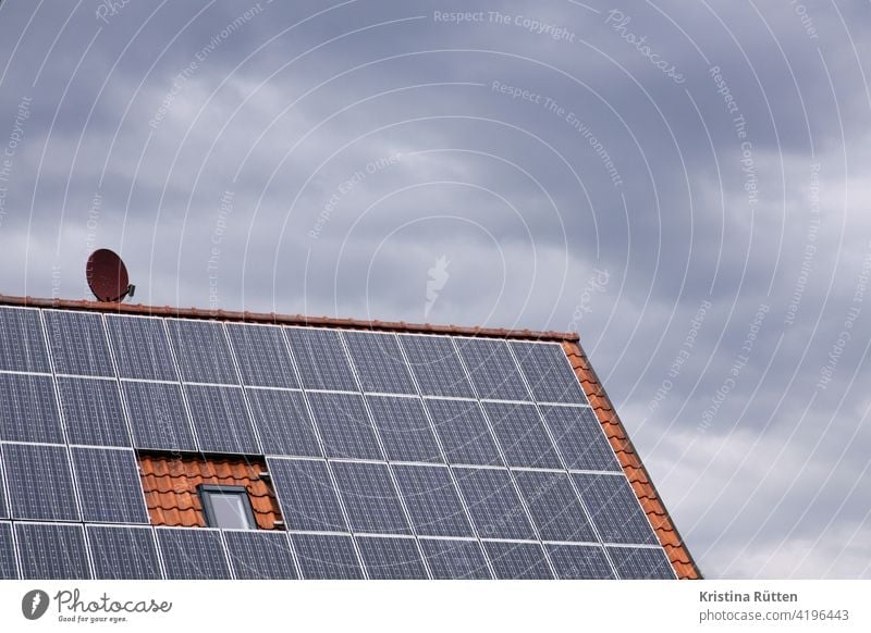 photovoltaic system, satellite dish, roof window that can no longer be opened and cloudy sky photovoltaics house roof system Roof House (Residential Structure)