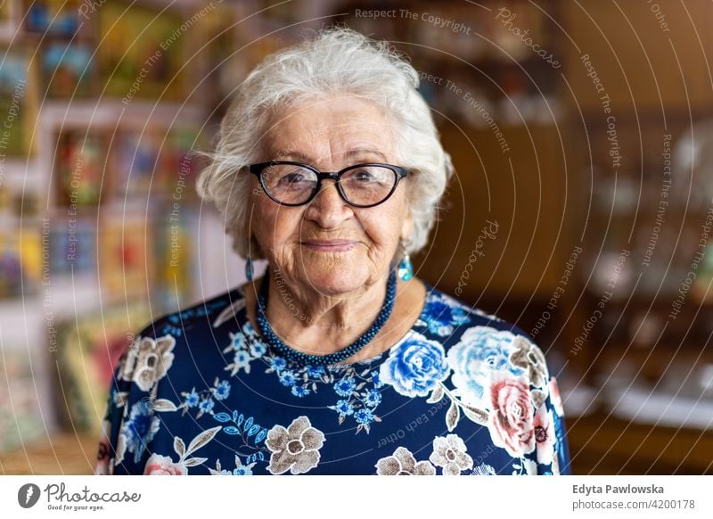 Portrait of an elderly woman at her home eople senior mature casual female Caucasian house old aging domestic life grandmother pensioner grandparent retired