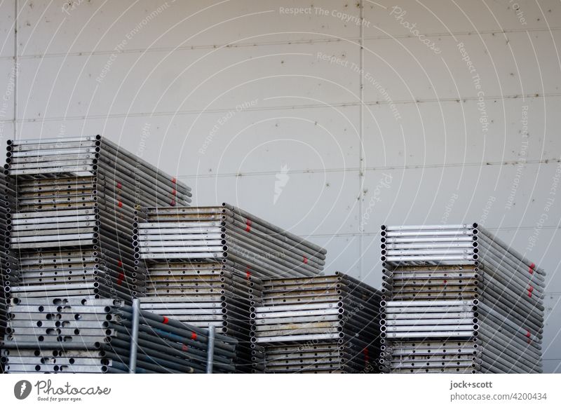 Scaffold floors in stock storage Scaffolding Scaffolding planks Metal Structures and shapes Stacked up Concrete wall Arrangement Many Collection