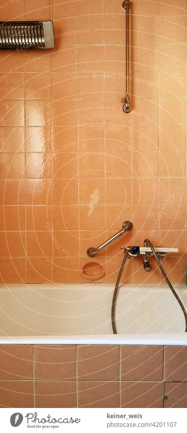 https://www.photocase.com/photos/4201107-old-bathroom-in-orange-with-electric-heater-and-faucet-with-shower-head-photocase-stock-photo-large.jpeg