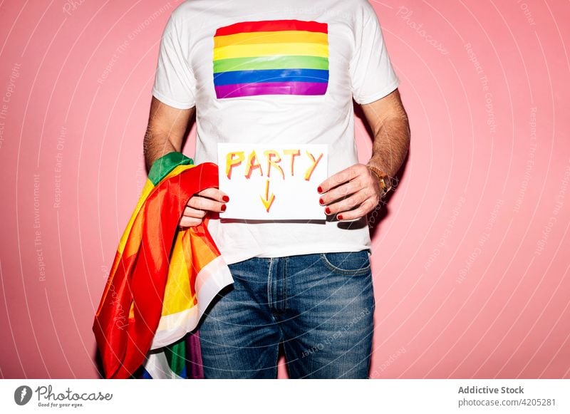 Faceless gay showing placard with Party text man lgbt party homosexual equal tolerance inscription solidarity concept flag pride male t shirt rainbow manicure