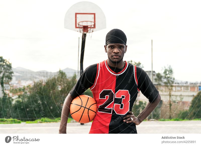 Serious Black Basketball Player with a Ball Next To His Face Stock Image -  Image of giving, fitness: 75746161