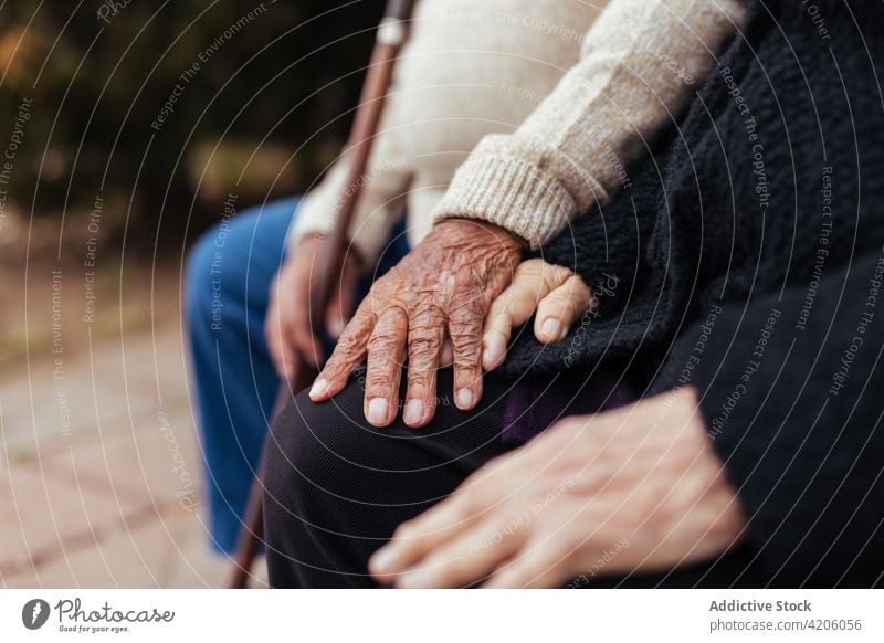 Anonymous elderly couple holding hands woman together person adult togetherness male female husband wife care married retirement two people senior adult