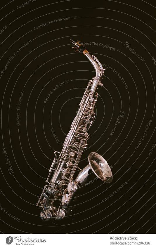 Modern saxophone isolated on black background instrument musical brass wind sound classic melody perform professional jazz tune art studio contemporary rhythm