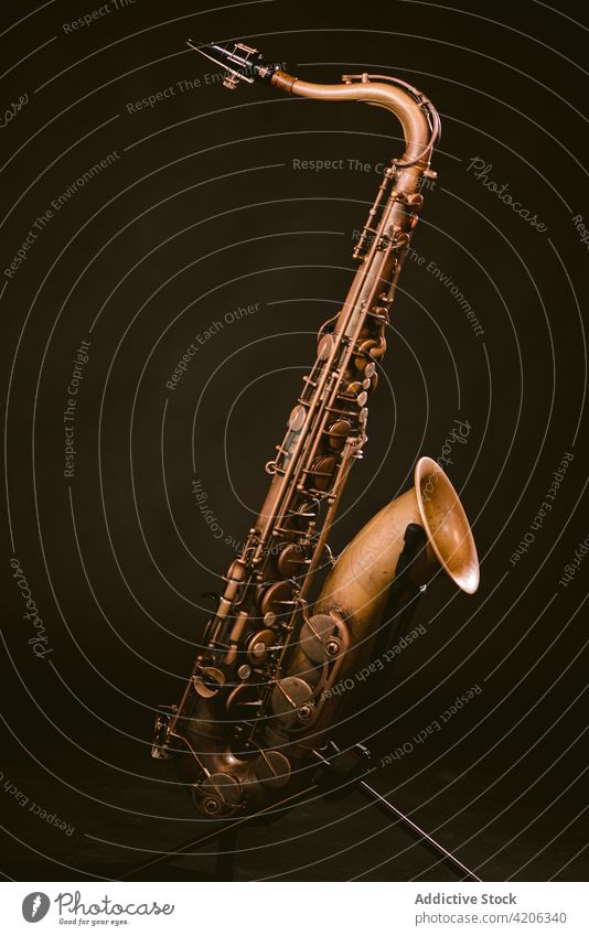 Modern saxophone isolated on black background instrument musical brass wind sound classic melody perform professional jazz tune art studio contemporary rhythm