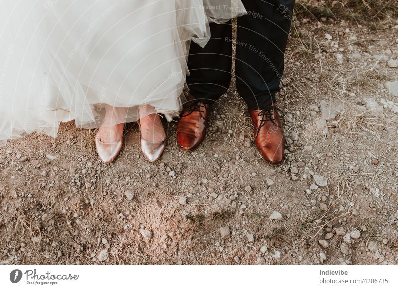 Bride and groom shoe detail on the ground on a wedding day. shoes bride big day feet beach sand foot legs summer woman nature people little soil small outdoors