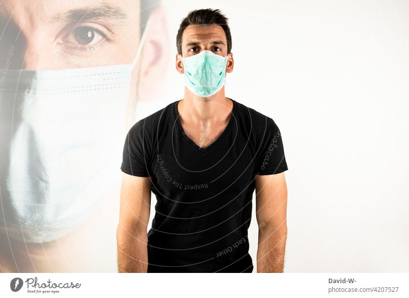 Man with mouth guard / breathing mask Mask corona pandemic Respirator mask coronavirus guard sb./sth. Mask obligation