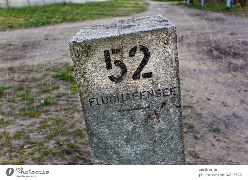 Way to the airport lake Berlin Far-off places Airport Airfield Spring Deserted Tegel Copy Space TXL hazy wide Milestone landmark waypoint Road marking Direction