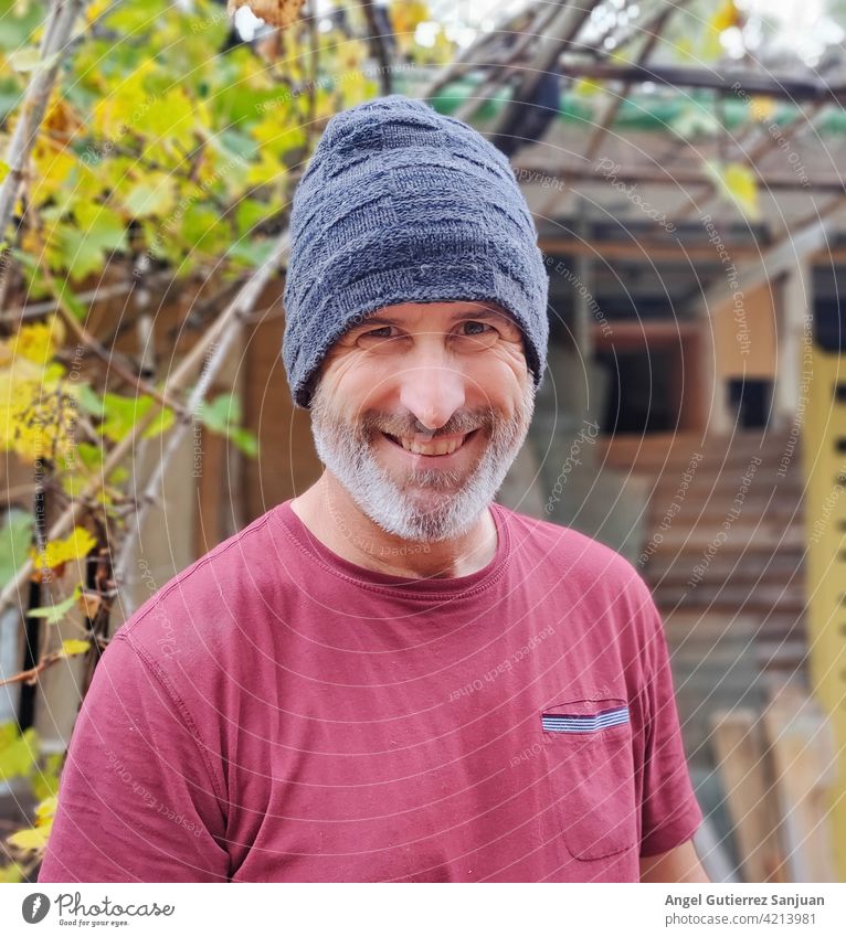 portrait of bearded man smiling with hat Portrait photograph Smiling Man Fashion Caucasian Colour photo Looking Lifestyle Young man 1 Person Adults Human being