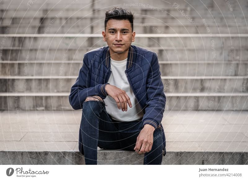Hispanic man wearing jeans and casual jacket young hispanic guy latin latino expression handsome one person cool model photography looking at camera friendly