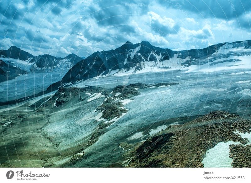 glacier ice Landscape Sky Clouds Climate change Bad weather Ice Frost Snow Alps Mountain Peak Glacier Gigantic Large Tall Blue Brown Green Black White Cold