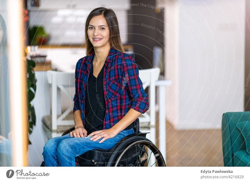 Young Woman In Wheelchair In Her Home wheelchair domestic life disability disabled confidence woman independent indoors home house people young adult casual