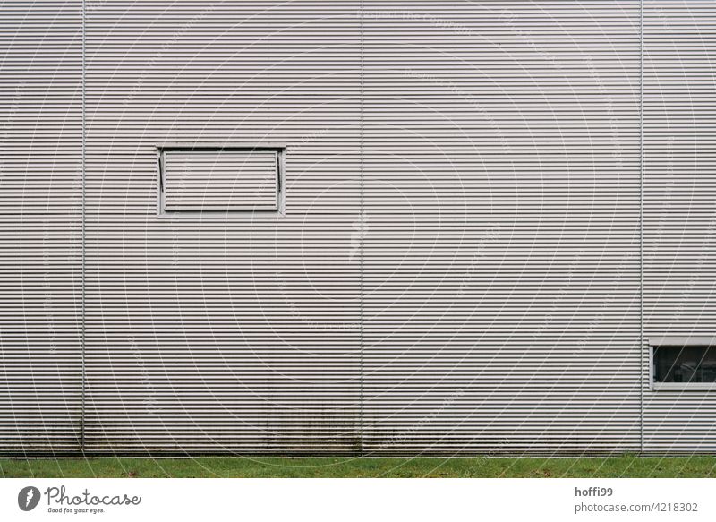 Ventilation hatch on grey corrugated metal wall Gray Hatch metal facade Corrugated sheet iron corrugated sheet metal facade minimalism Industrial facade Storage