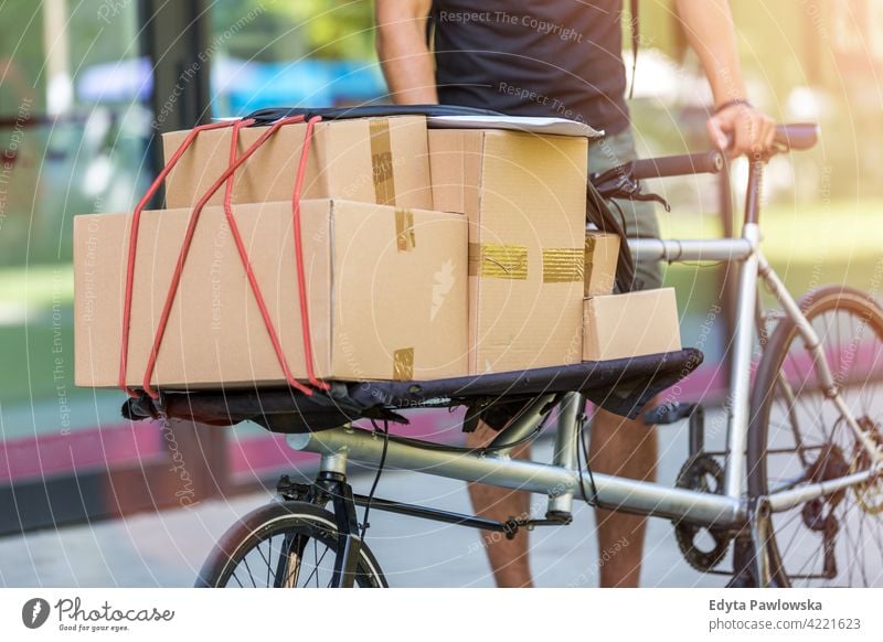 Download Bike Courier Making A Delivery A Royalty Free Stock Photo From Photocase