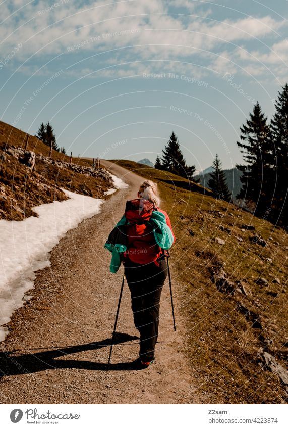 Young woman on a mountain hike Pre-alpes closeness to nature outdoor soinsee Hiking Outdoor Sports warm colors mountains Alps Bavaria Mountain Colour photo