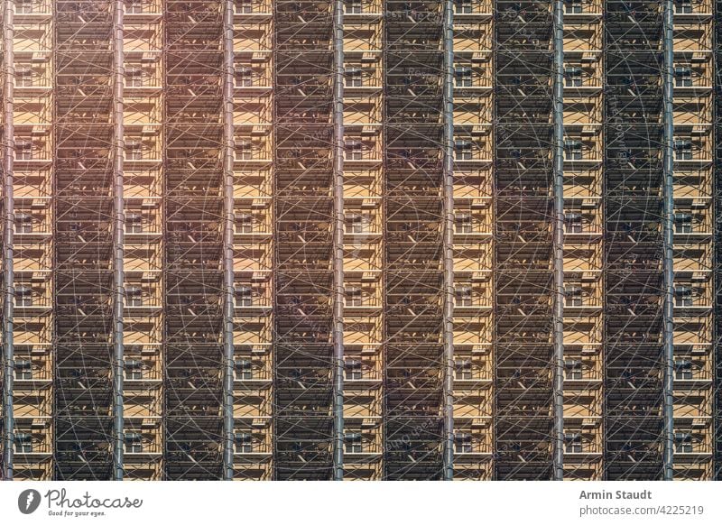architecture pattern, berlin facade with construction site scaffolding industry frame workplace framework seamless repetition big huge anonymous house rent