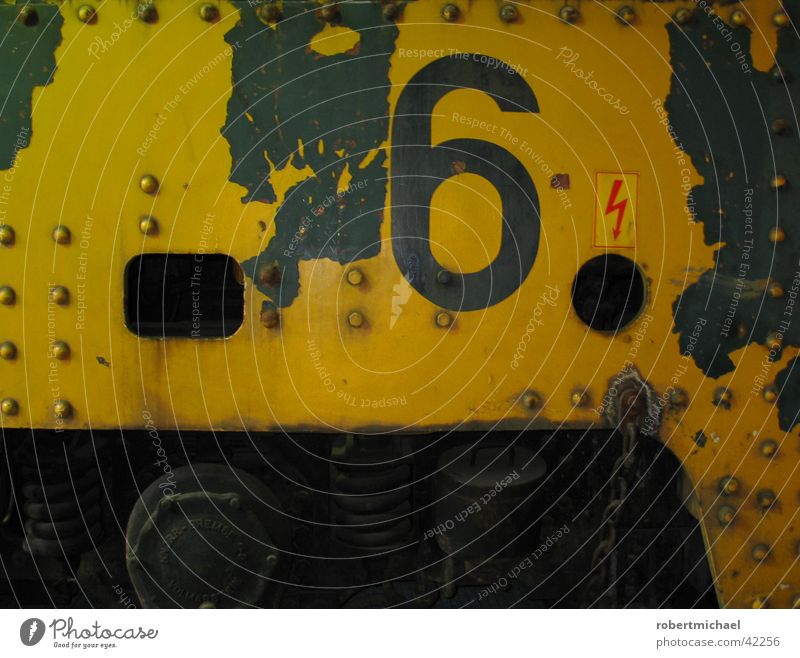 Number Six. Railroad Driving Typography Red Yellow Stencil Engines Vehicle Wall (building) Rust Route 66 Digits and numbers Electricity Lightning Steel Iron