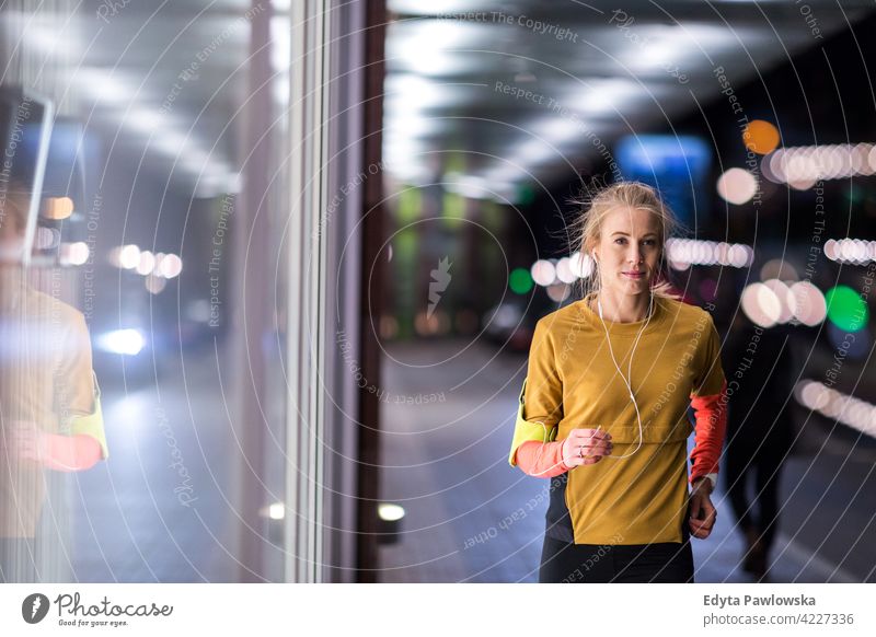 Young man running in urban area - a Royalty Free Stock Photo from Photocase