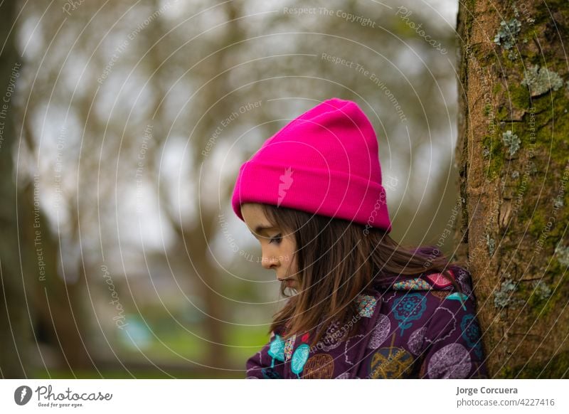 close-up Caucasian girl standing up With casual clothes and a pink hat. In a natural park. beautiful beauty casual clothing caucasian caucasian ethnicity child