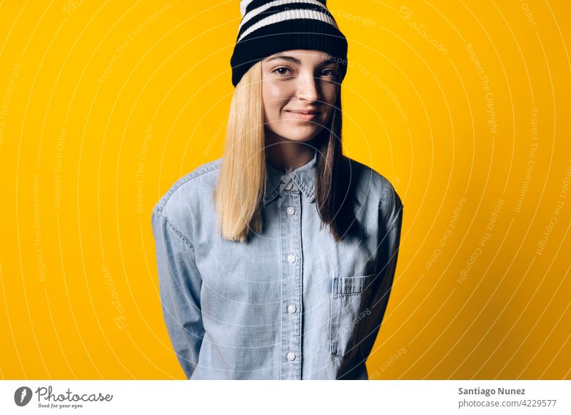 Happy Girl Wearing Hat Portrait smile smiling cute innocence cheerful happy happiness studio yellow background portrait looking at camera expression colorful
