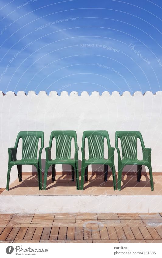 Spaces | Sitting between the chairs Chair plastic Green Roof terrace Summer Sun vacation Platform tiles Wood wooden floor Wall (building) Roofing tile Row 4
