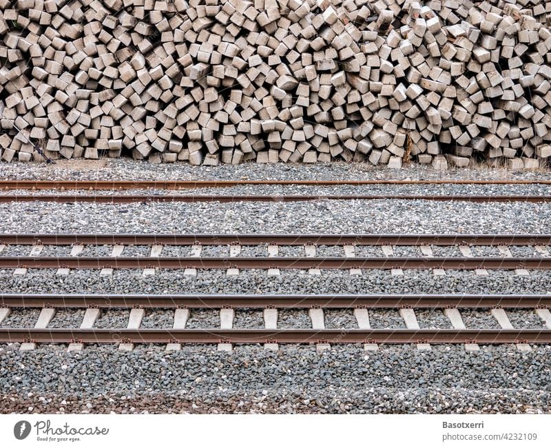 Railway tracks with stacked concrete railway sleepers in the background Track railway tracks Sleepers Stack Heap Transport Railroad Railroad tracks rails