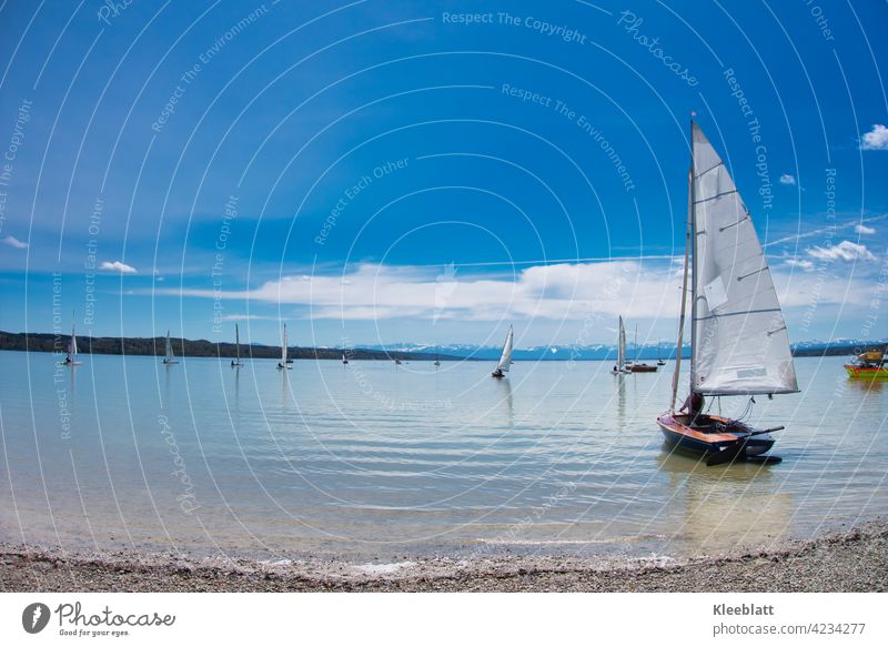 Sailing boats are launched on the Ammersee - time out and relaxation in beautiful spring weather Sailboat sailboats Water mountains Sky Blue cautious clouds