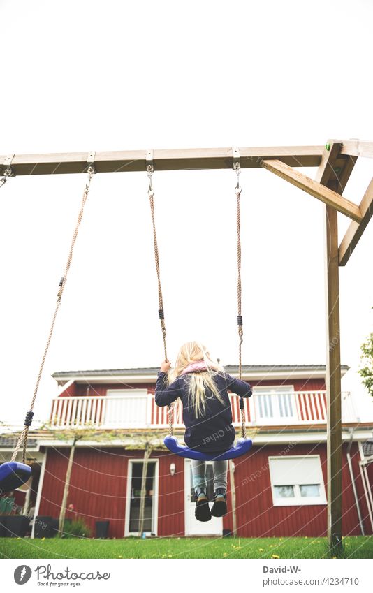 Child on the swing Swing To swing fun Joy Garden at home Girl Infancy Playing Joie de vivre (Vitality)