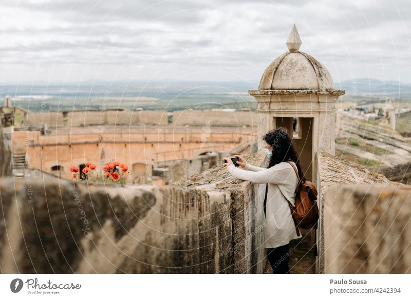 Woman with facemask traveling fortification UNESCO landmark fortress medieval heritage tourism old architecture unesco wall Travel photography Traveling