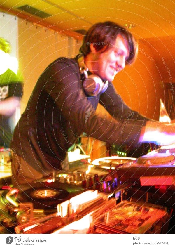 bob humid Disc jockey Record player Man Headphones Musician electronic music Laughter Orange Turntable