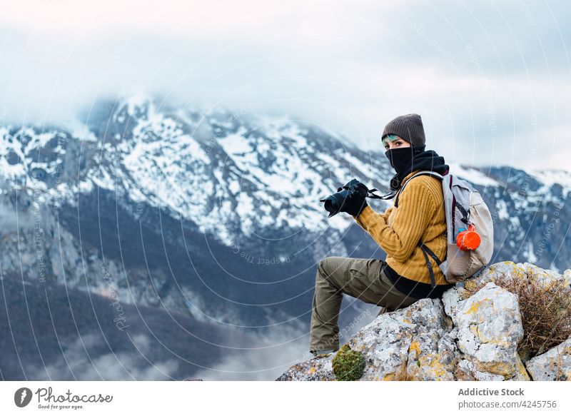 Woman with photo camera in mountains woman traveler photographer valley take photo tourism wanderlust moment hike hobby vacation using tourist photography