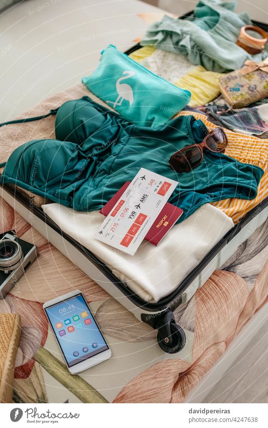 Cropped Shot Of Woman Packing Suitcase For Free Stock Photo and