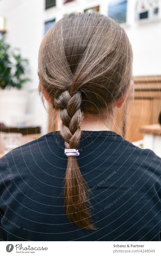 Child with braided pigtail hairstyle Back of the head Braids Elastic hairband Lichen Girl Neck Head ears Sweater Hair and hairstyles Human being Feminine