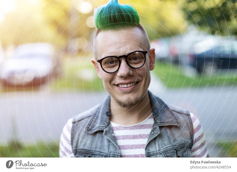 Portrait of a cool young man with colorful mohawk hair portrait adults people one person casual teenage male alone trendy fashion punk style stylish retro