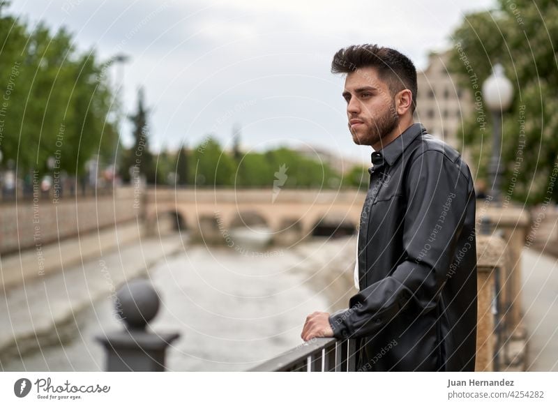 caucasian man with beard, dressed in black leather jacket young guy professional model stylish fashionable handsome shirt standing posing success cool elegant