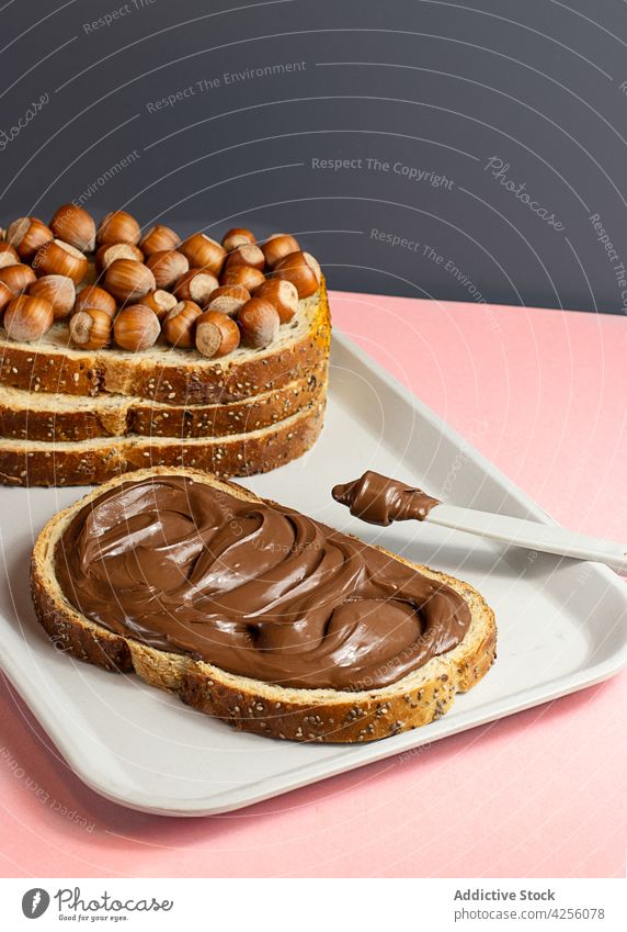 Chocolate cream sandwich on a tray on the table chocolate chocolate sandwich breakfast nougat edible shot portion fat taste spreading long loaf morning melted