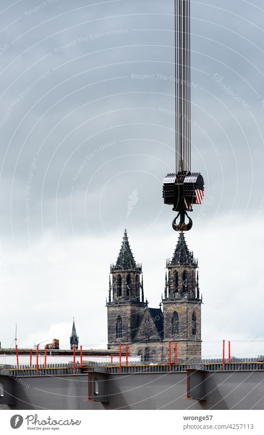 Taking the Magdeburg Cathedral on the Hook Dome Cathedral Towers Checkmark crane hook hock attach Colour photo Tourist Attraction Exterior shot Landmark