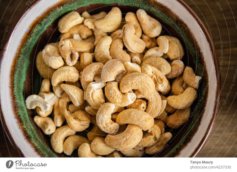 roasted cashew nuts in a ceramic bowl Cashew nut Snack Vitamin Vegan diet Still Life Ingredients Vegetarian diet Nutrition Close-up Organic naturally Raw Diet