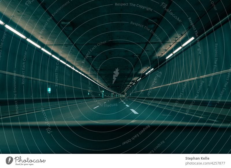 Driving through an empty underground tunnel in the teal and orange film look. car vehicle transport transportation drive road automobile background city urban