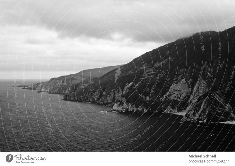 Coast in Ireland coast coastal strip Ocean Landscape Seashore Atlantic Ocean Atlantic coast Water tranquillity Calm calm atmosphere Gray rainy Clouds Loneliness