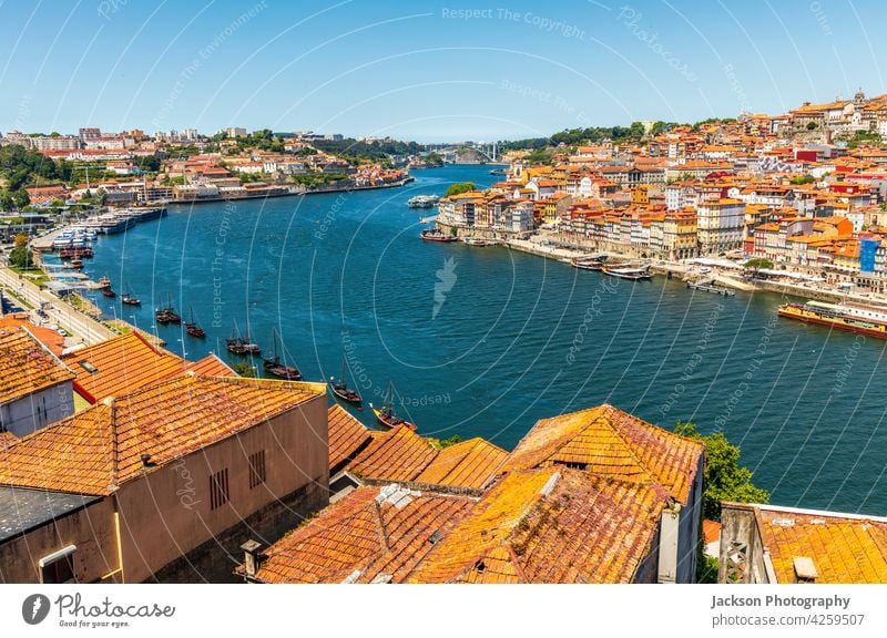 Old architecture of Porto and Vila Nova de Gaia, Portugal cityscape porto oporto vila nova de gaia douro boat portugal river orange roof sky blue sky copy space