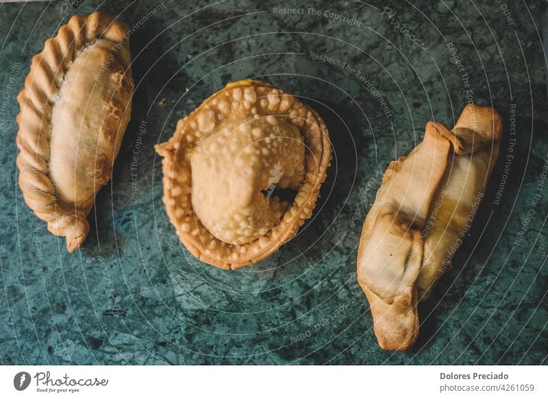 Assorted stuffed empanadas typical of South America pastel homemade lunch antipasto chicken appetizer ethnic latin cooked hispanic table pastry cooking