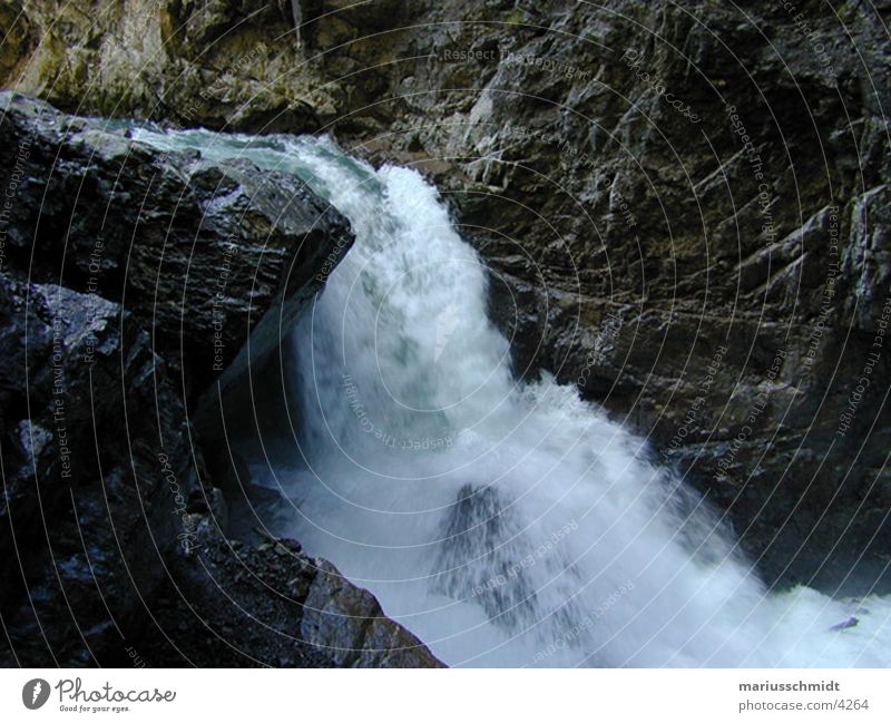 waterfall Cave Force of nature Speed Fresh Electricity Brook Mountain stream Waterfall Rock Stone Nature dark stream of water Refreshment