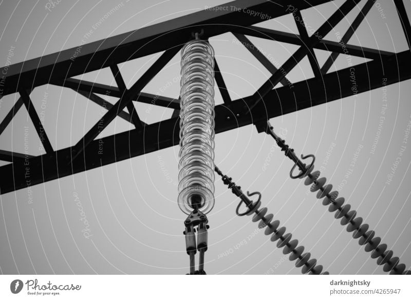 Insulators made of glass on a high voltage overhead line in detail Renewable energy Technology Energy crisis Power transmission diagonal intersecting Industry