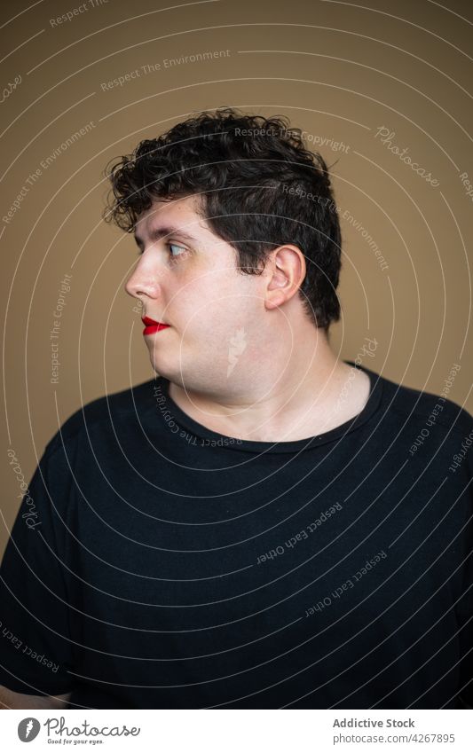 Androgynous plus size man with red lips alternative feminine identity androgynous eccentric accept queer transgender male unusual lgbtq independent extravagant