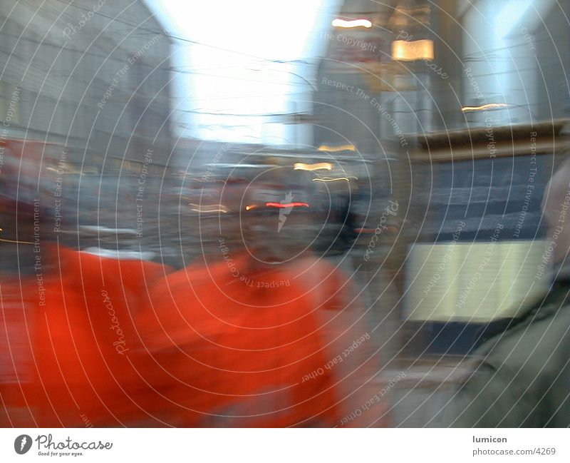 2 men in orange Blur Human being face