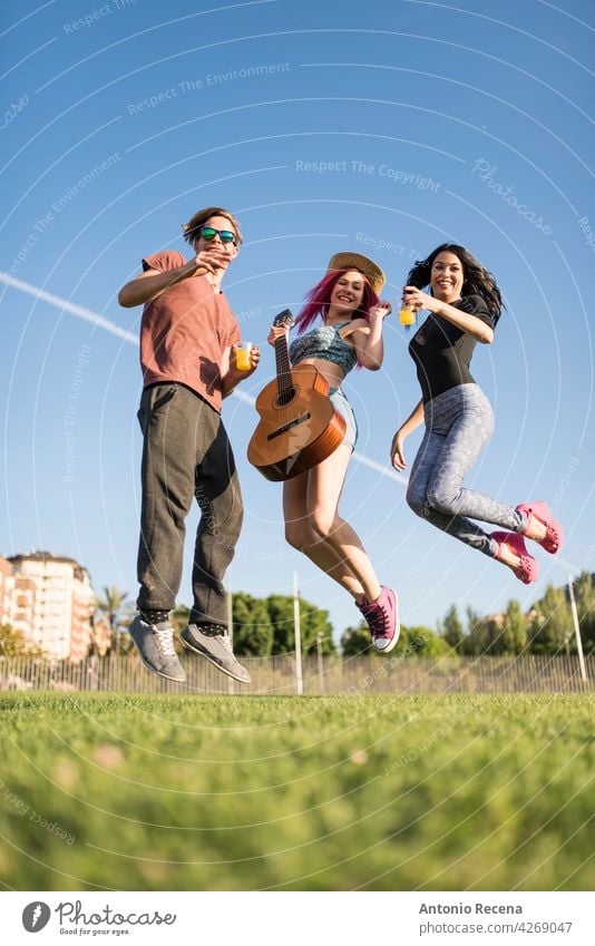 group of friends enjoy their free time in the park playing guitar and enjoying woman young attractive 20s people person youth urban women pretty pretty people