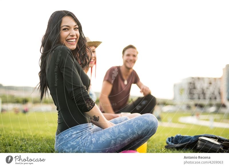 A group of young friends have refreshments in the park on a spring day outdoors woman attractive 20s joy people person youth urban women pretty pretty people