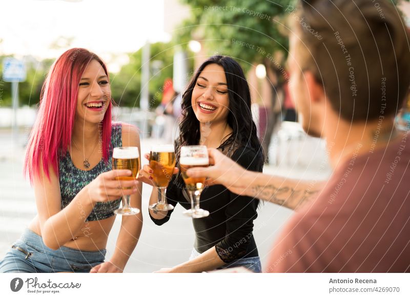Friends drinking beer having fun in bar terrace with beer woman young attractive 20s joy people person youth urban women pretty pretty people outdoors city